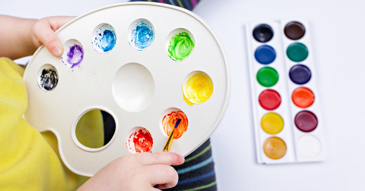 What is the difference between Intense Rainbow dye and normal rainbow dye? - Crop child mixing watercolor paints in palette