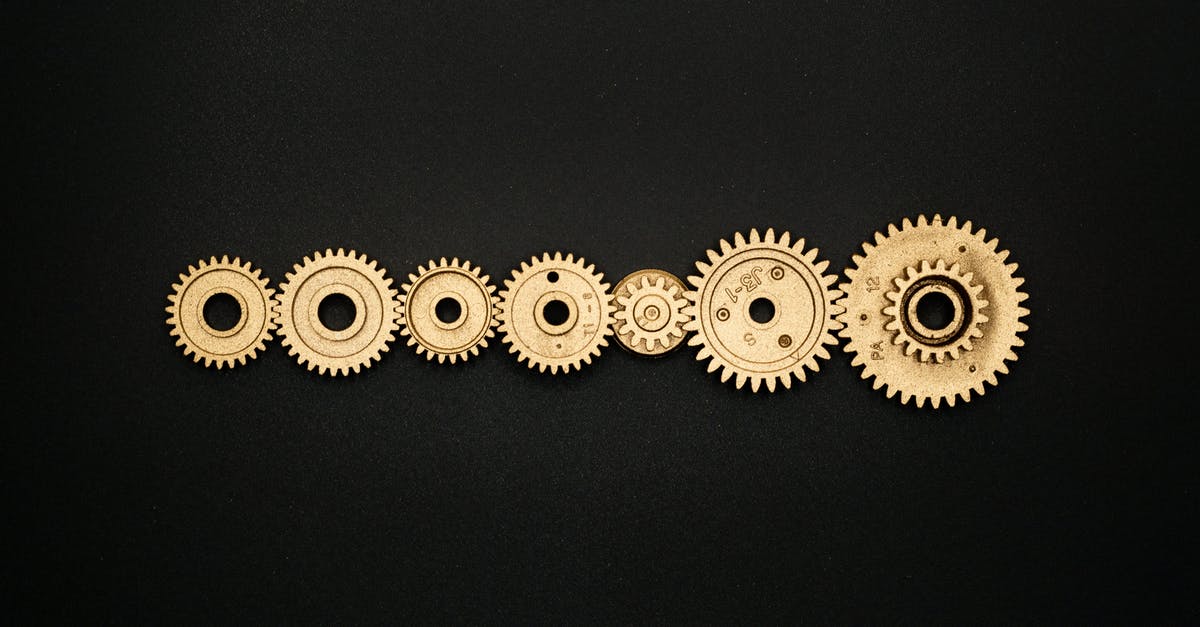 What is the difference between the Circle-K and Lawson Power Cube? - Photo of Golden Cogwheel on Black Background What is the difference between the Circle-K and Lawson Power Cube? - Photo of Golden Cogwheel on Black Background