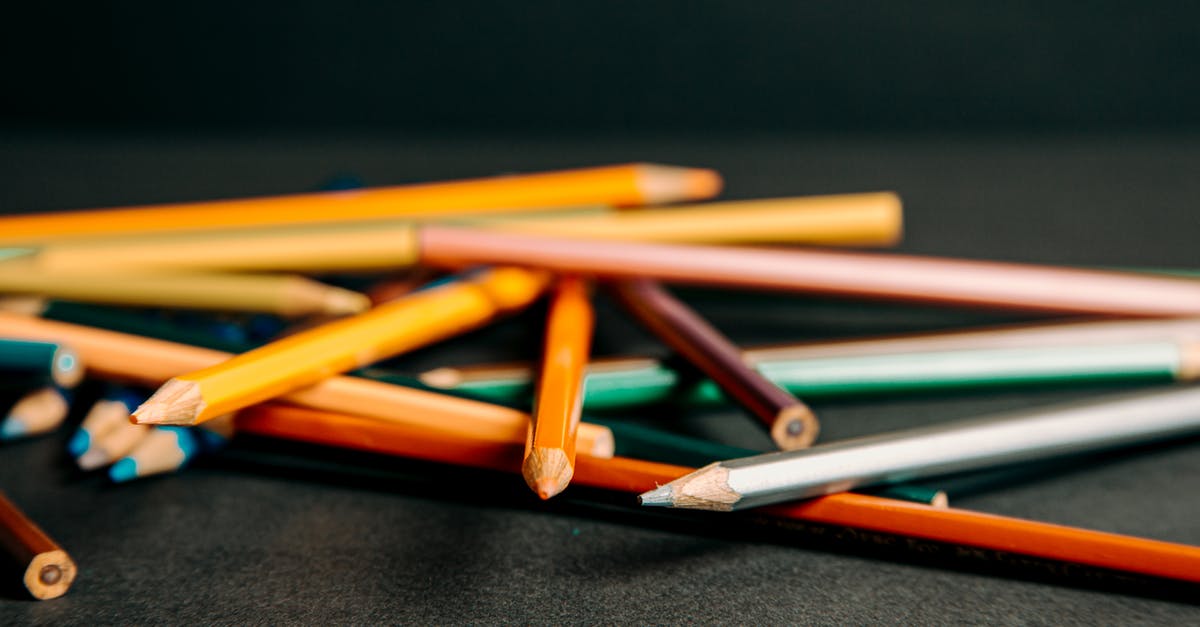 What is the difference between the yellow and brown exploding barrels? - Colorful pencils lying on each other What is the difference between the yellow and brown exploding barrels? - Colorful pencils lying on each other