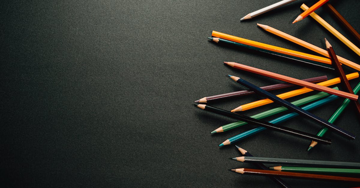 What is the difference between the yellow and brown exploding barrels? - From above of colourful pencils scattered on dark surface in contemporary dark studio while placed on each other on black background What is the difference between the yellow and brown exploding barrels? - From above of colourful pencils scattered on dark surface in contemporary dark studio while placed on each other on black background
