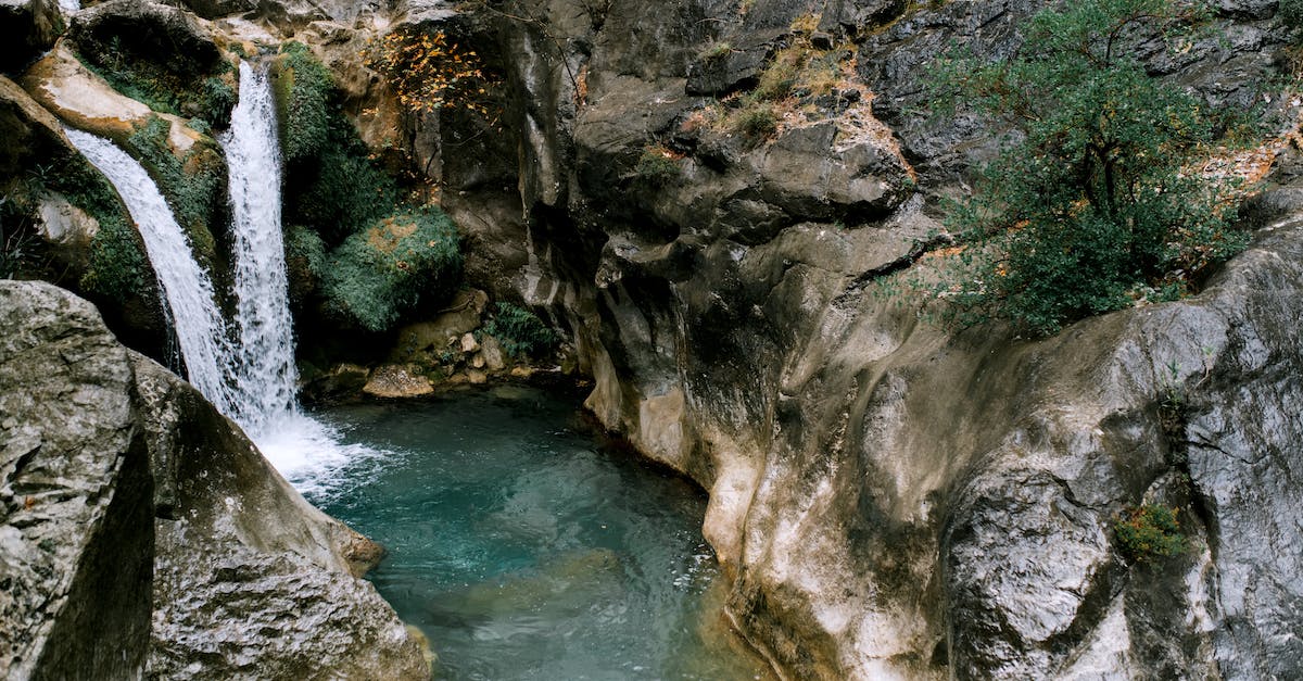 What is the difference between waveclear and pushing power? - Picturesque scenery of high waterfall falling in water stream between  rocky mountains