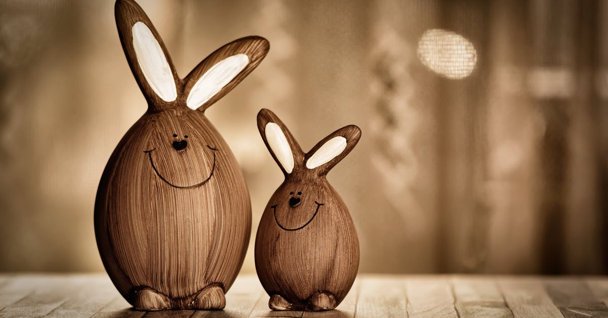What is the different between 3 tap nitro and perfect nitro - Wooden eggs in form of rabbits with big ears and lines with dots representing muzzle placed on table in room with artificial light during Easter holiday