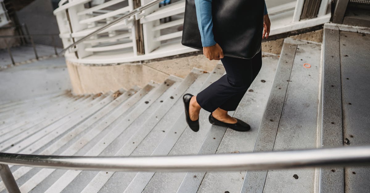 What is the efficient way to reach the Star Metal and Black Ice zone? - Unrecognizable female in casual clothes and black leather bag walking up concrete staircase with metal railing on street in city What is the efficient way to reach the Star Metal and Black Ice zone? - Unrecognizable female in casual clothes and black leather bag walking up concrete staircase with metal railing on street in city