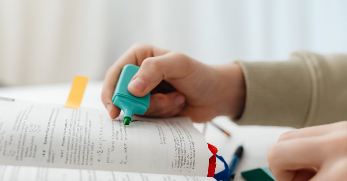 What is the exclamation mark in the hero selection screen? - Person Using Blue Highlighter Pen On A Book Page