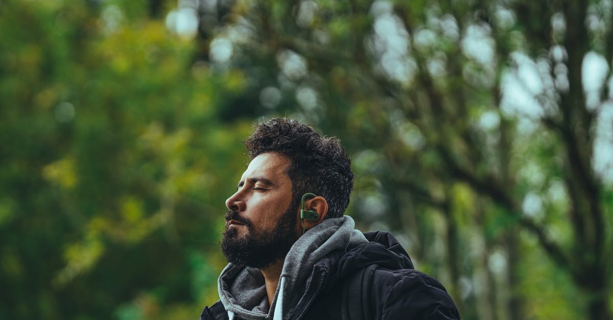 What is the favorite pokemons feature good for? - Contemplative bearded ethnic male in warm jacket listening to music in earbuds while sitting with eyes closed in lush park What is the favorite pokemons feature good for? - Contemplative bearded ethnic male in warm jacket listening to music in earbuds while sitting with eyes closed in lush park