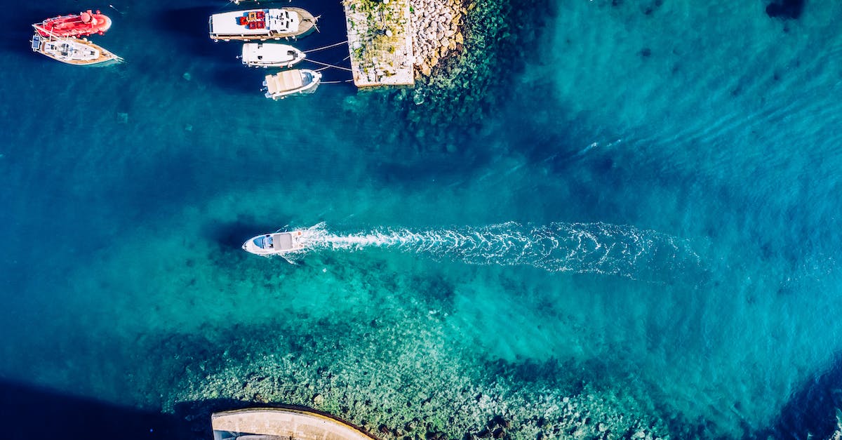 What is the fewest cycles to clear Majora's Mask, without exploiting glitches? - Aerial Photography of Boats in the Sea