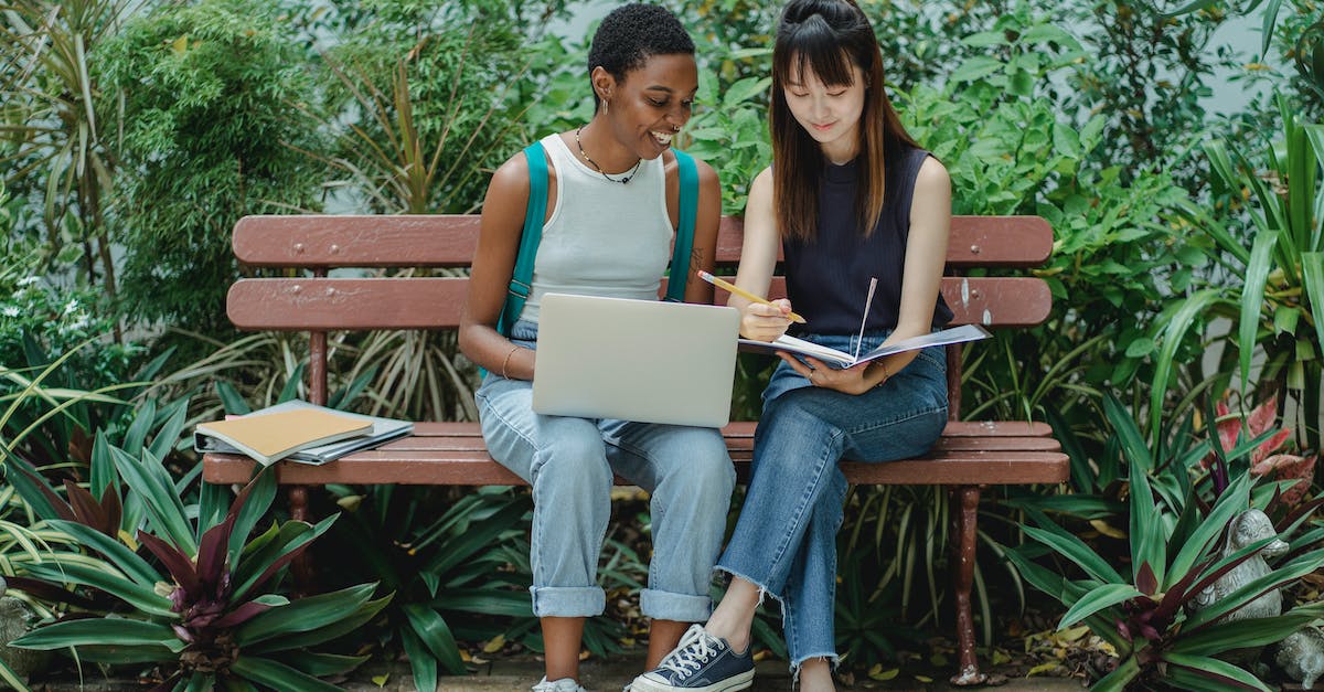 What is the full research tree? - Content diverse female students studying in green park