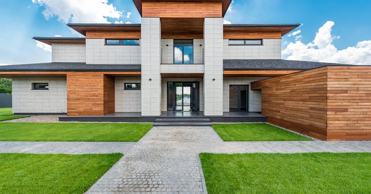 What is the jizo in the main courtyard for? - Contemporary villa against cloudy blue sky What is the jizo in the main courtyard for? - Contemporary villa against cloudy blue sky