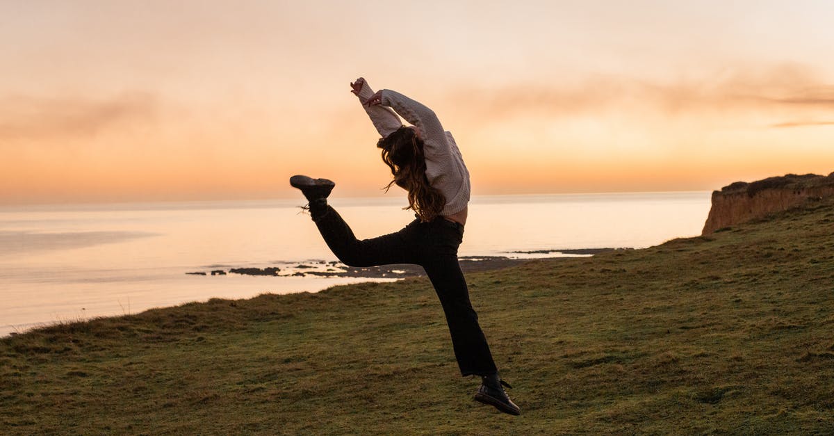 What is the jump key? - Man in White Dress Shirt and Black Pants Standing on Green Grass Field during Sunset