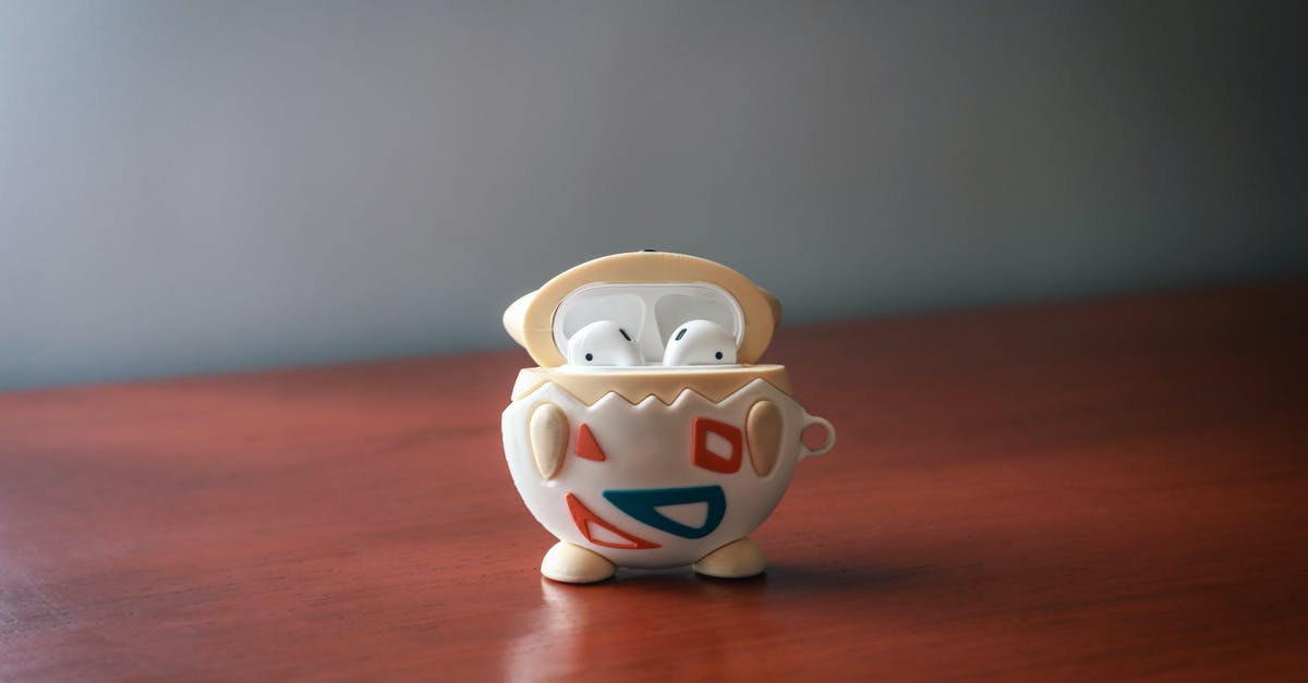 What is the legality of Pokemon showdown? [closed] - Close up of Airpods on a Wooden Surface