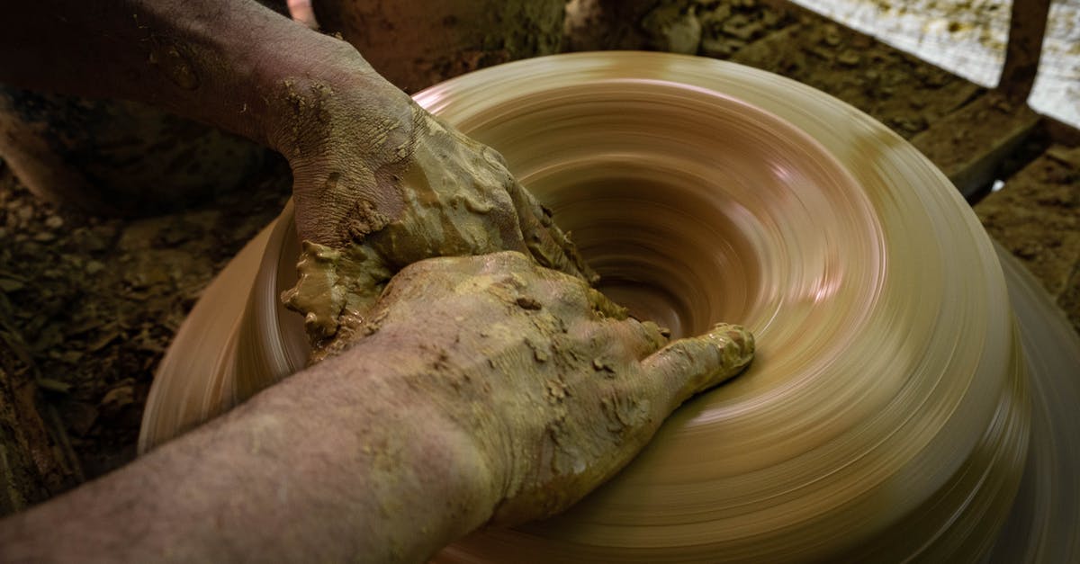 What is the level bonus for after making a creation? - A Person Molding A Clay Pot