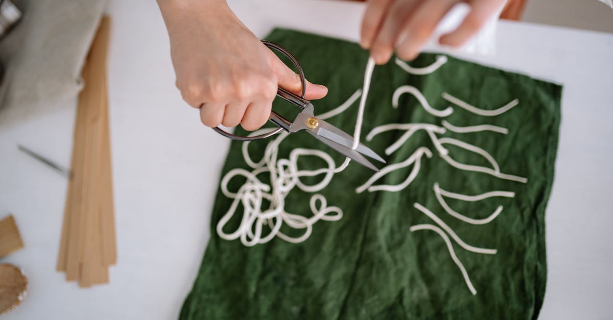 What is the level bonus for after making a creation? - Person Holding Silver and Black Scissors