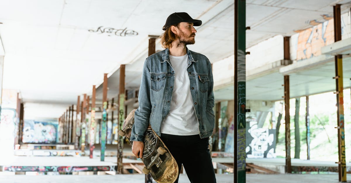 What is the level cap in Overwatch? - Woman in Black Hat and Gray Jacket Standing Near Glass Window What is the level cap in Overwatch? - Woman in Black Hat and Gray Jacket Standing Near Glass Window