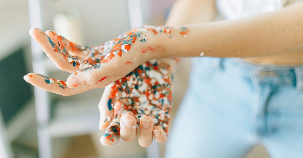 What is the male human character wearing on the cover of Animal Crossing New Leaf? - Person in White Shirt With Red and White Manicure