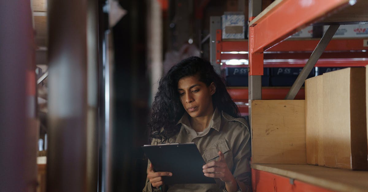 What is the maximum inventory capacity of the exosuit? - Woman in Brown Jacket Using Laptop Computer