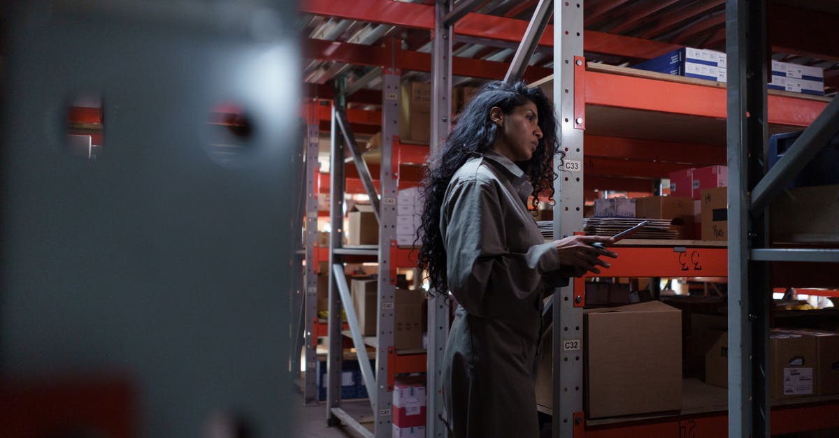 What is the maximum inventory capacity of the exosuit? - Woman Wearing Gray Uniform inside the Warehouse What is the maximum inventory capacity of the exosuit? - Woman Wearing Gray Uniform inside the Warehouse