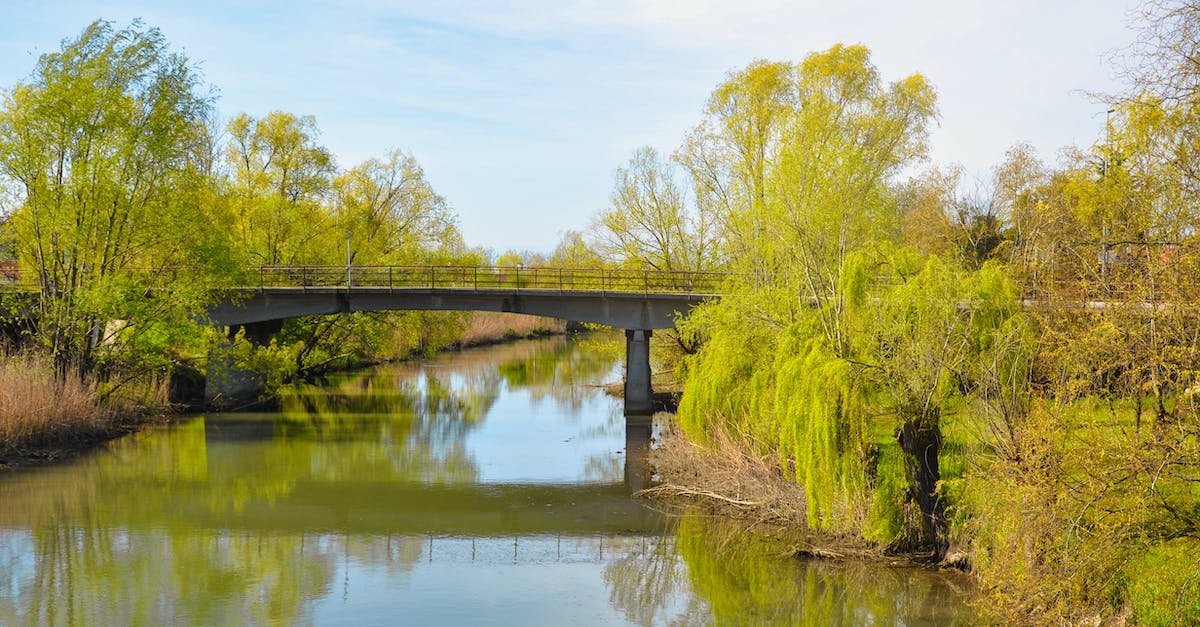 What is the most efficient way to make triangles? - Concrete bridge over river in green countryside