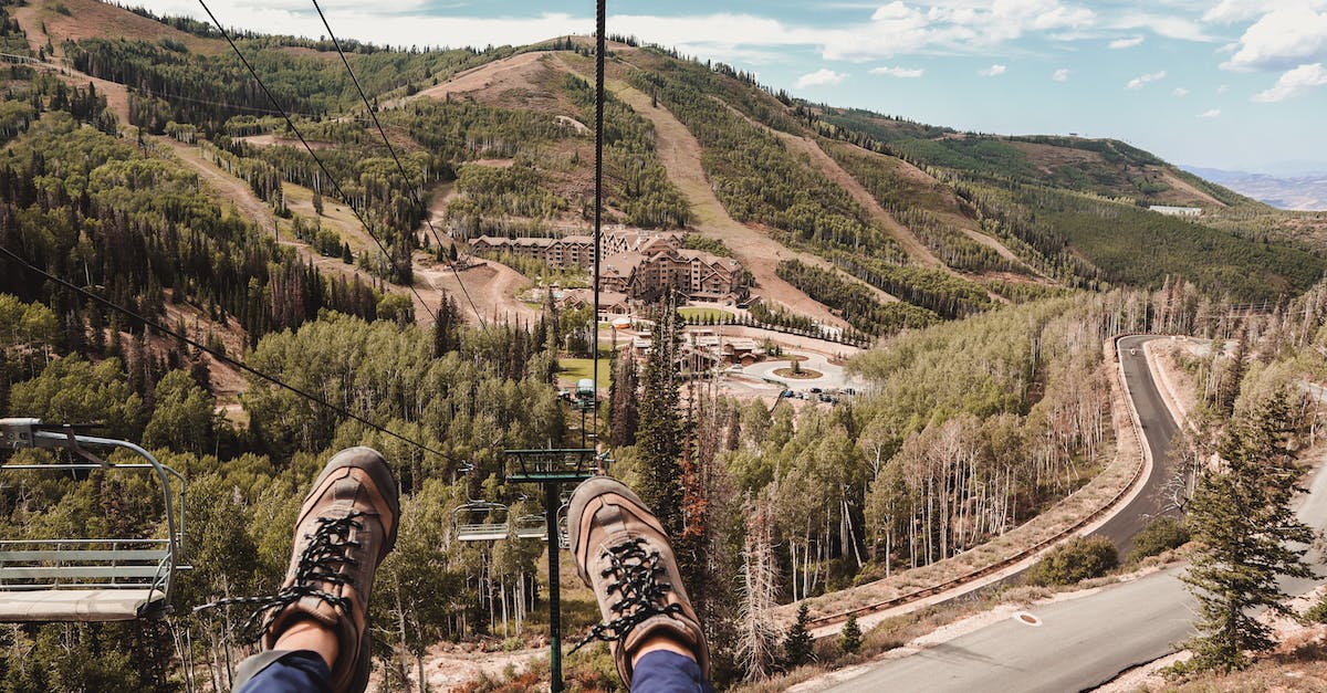 What is the most efficient way to take down a Titan? - Tourist riding down on ropeway in hilly terrain