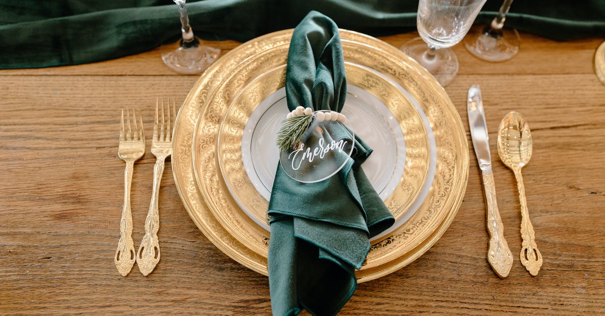 What is the name of the maximum training level setting? - Table setting with elegant tableware and personalized napkin ring