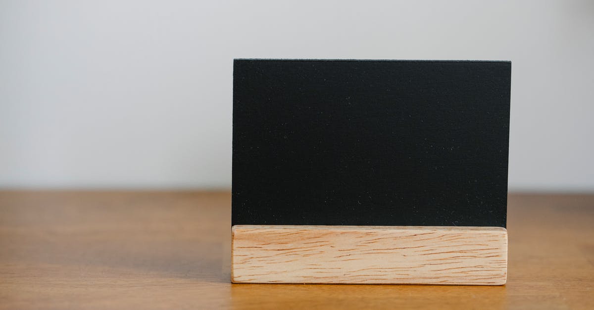 What is the name of this space game? - Name card on wooden table