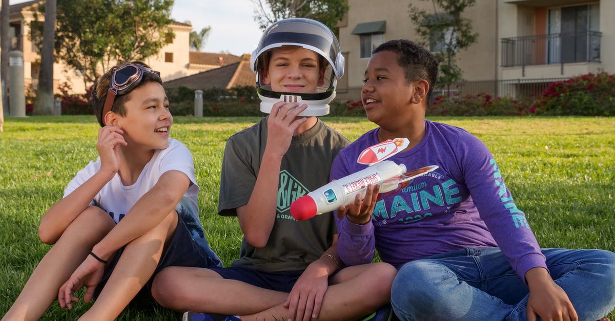 What is the optimal Rocket League doubles tactic? - Man in Blue Crew Neck T-shirt Sitting Beside Boy in White Tank Top What is the optimal Rocket League doubles tactic? - Man in Blue Crew Neck T-shirt Sitting Beside Boy in White Tank Top