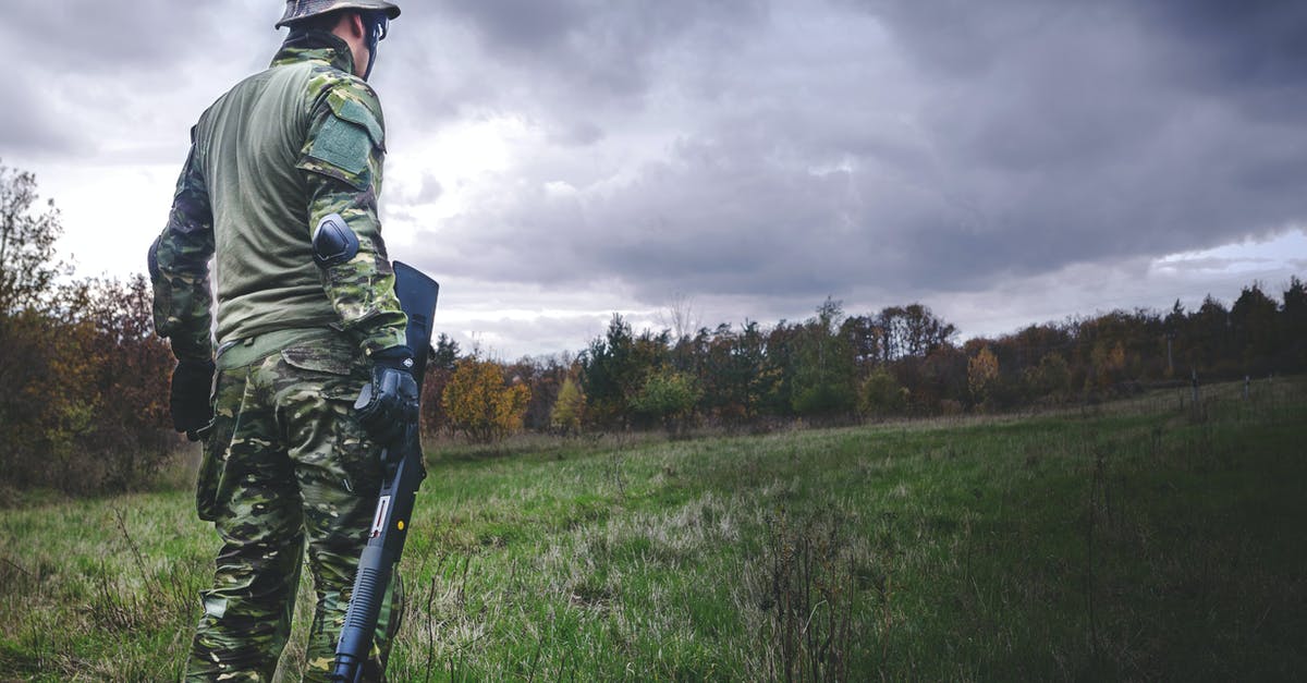 What is the optimal Weapon + Perk combo for Damage Per Second + Cheap Ammo in Fallout 76? - Man in Camouflage Soldier Suit While Holding Black Hunting Rifle