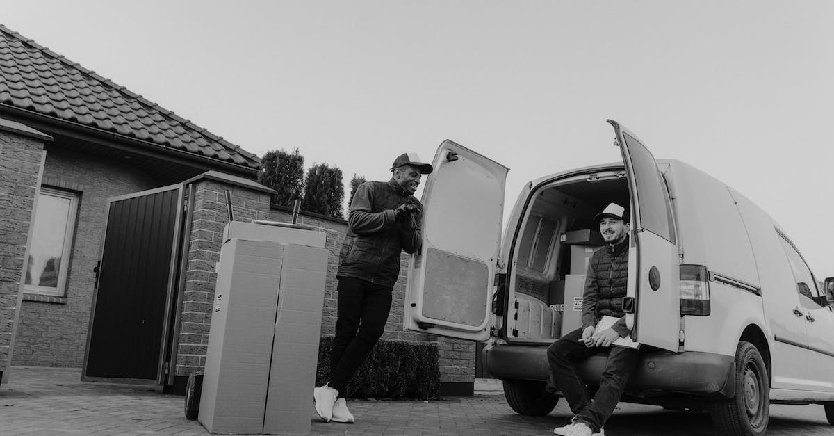 What is the order of ringing the bells for the quest Buried Secrets? [duplicate] - Grayscale Photo of Man in Jacket Standing Beside Van