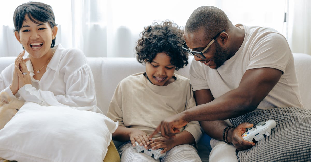 What is the point of having an alliance with your partner's family? - Caring father teaching son using joystick What is the point of having an alliance with your partner's family? - Caring father teaching son using joystick