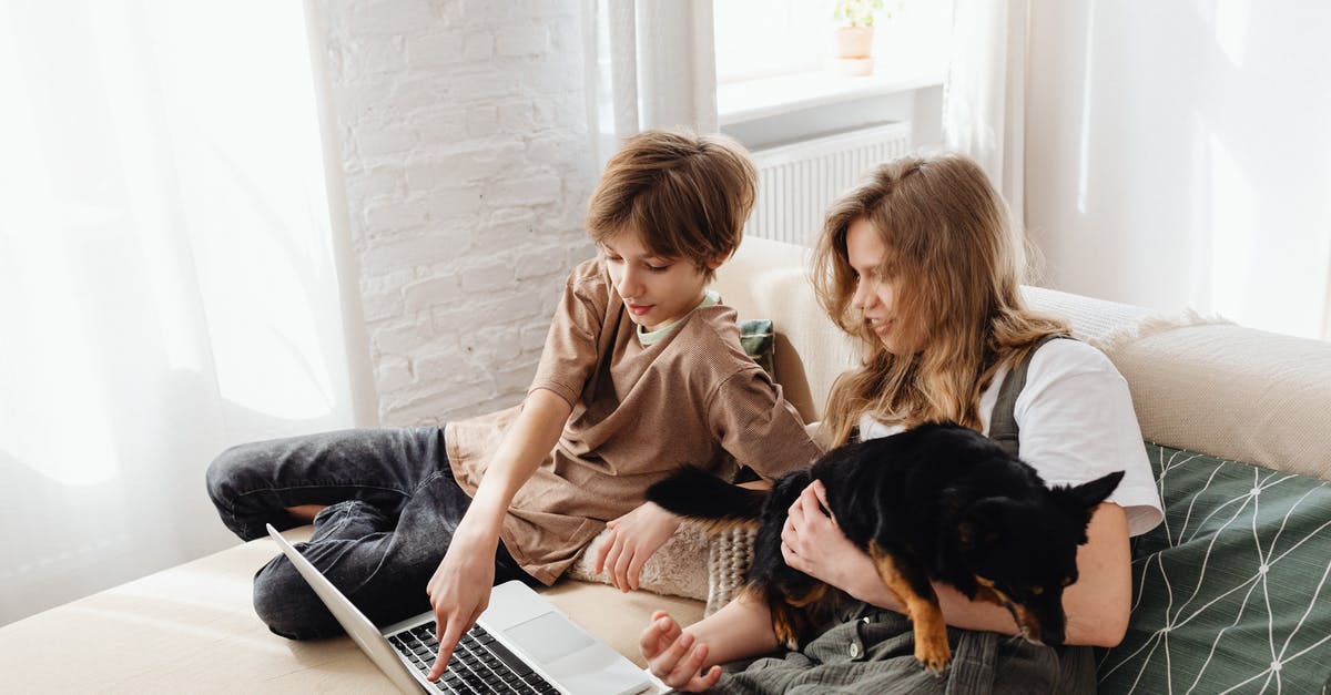 What is the point of rescuing the siblings in the jungle? - 2 Boys Sitting on Bed Using Macbook Pro