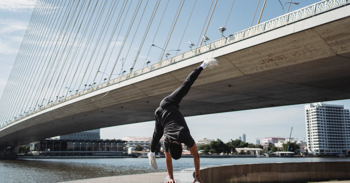 What is the "loop around the back" trick on Sky Force Reloaded? - Anonymous fit dancer performing trick on fence in town