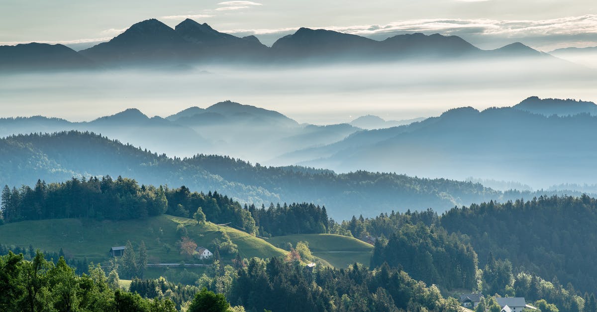 What is the range for the grenade launcher attachment? - Mountainous valley with evergreen forest against misty sky What is the range for the grenade launcher attachment? - Mountainous valley with evergreen forest against misty sky