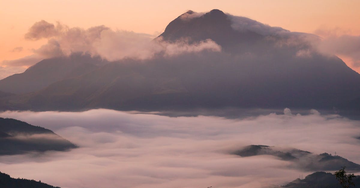 What is the range of a Pokemon's weight and height? - Light blue evening sky over tall majestic mountain and heavy clouds over forest in valley in evening What is the range of a Pokemon's weight and height? - Light blue evening sky over tall majestic mountain and heavy clouds over forest in valley in evening