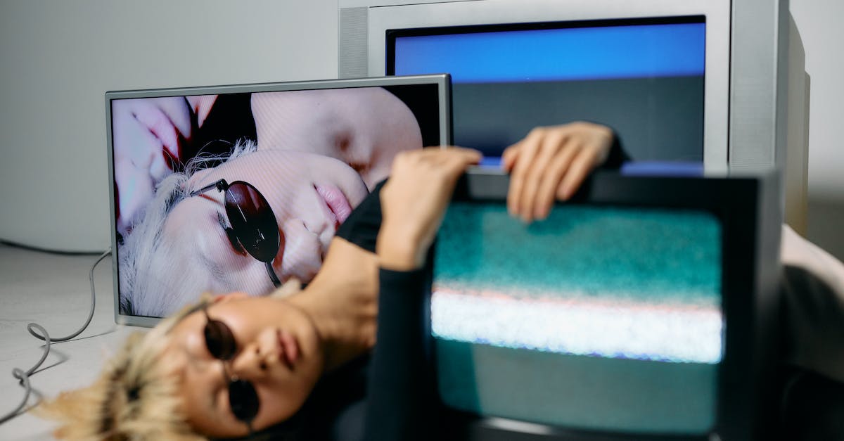 What is the screen that appears after the hero selection with coloured bars and numbers? - Photo of Woman Hugging CRT Television What is the screen that appears after the hero selection with coloured bars and numbers? - Photo of Woman Hugging CRT Television