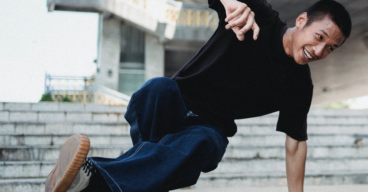What is the significance of personality & power level? - Young Asian man breakdancing near stairs What is the significance of personality & power level? - Young Asian man breakdancing near stairs