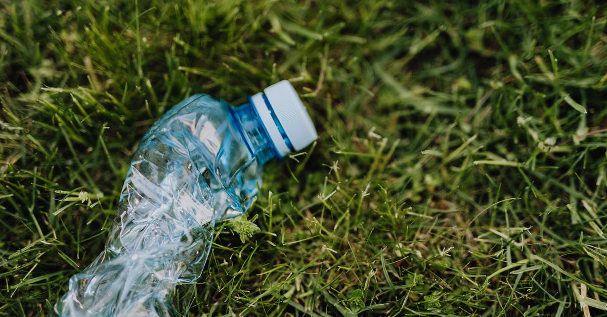 What is the term used to describe objects appearing from nowhere? - From above of blue crumpled plastic bottle thrown on green park lawn on sunny summer day What is the term used to describe objects appearing from nowhere? - From above of blue crumpled plastic bottle thrown on green park lawn on sunny summer day
