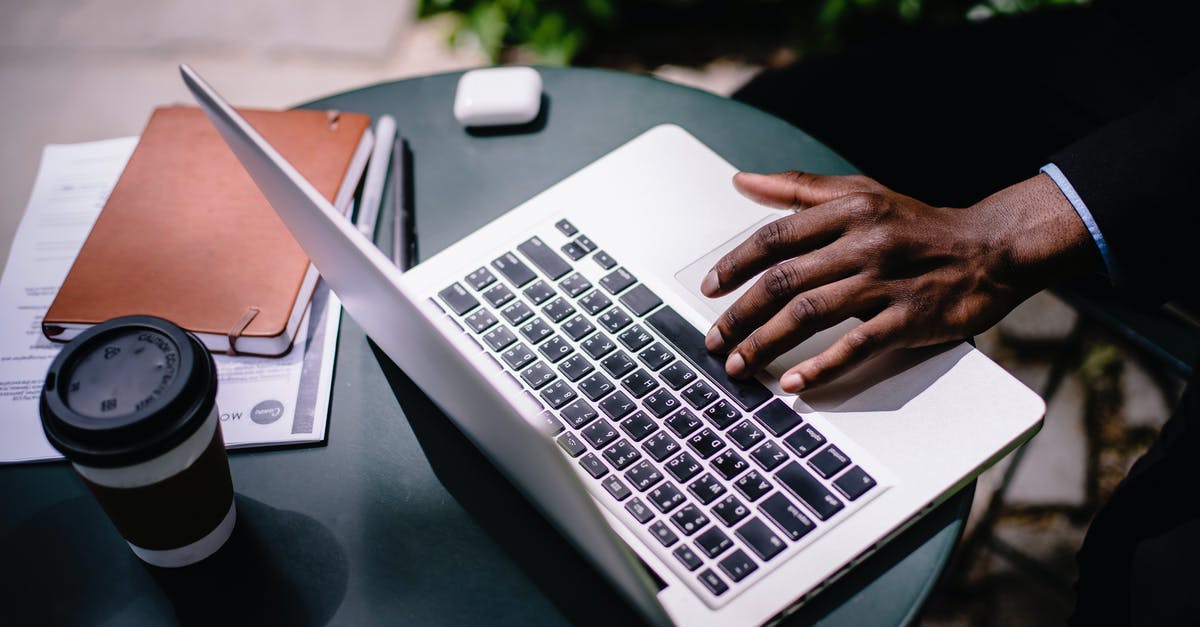 What is the use of research table in rust? - Crop unrecognizable black businessman typing on laptop in street cafe What is the use of research table in rust? - Crop unrecognizable black businessman typing on laptop in street cafe