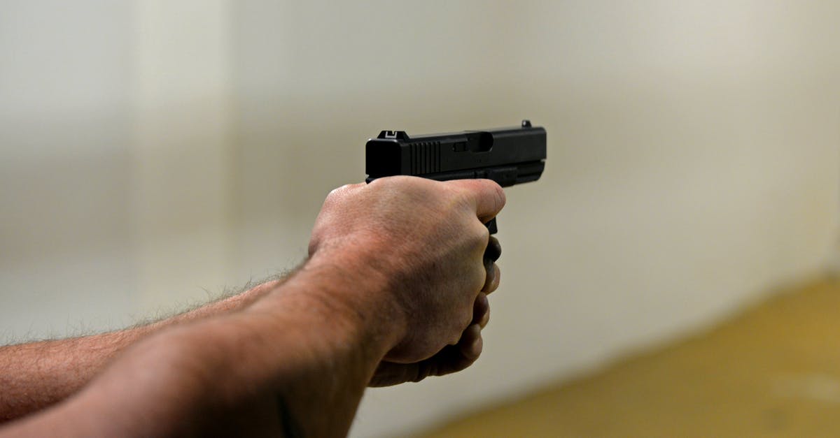 What is the weapon damage range formula? - Crop man firing pistol in shooting range
