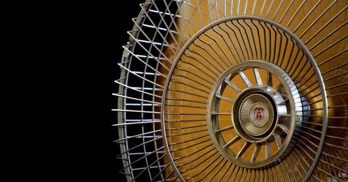 What is this coolness rank? - Close-up Photography of Gray Stainless Steel Fan Turned on Surrounded by Dark Background What is this coolness rank? - Close-up Photography of Gray Stainless Steel Fan Turned on Surrounded by Dark Background