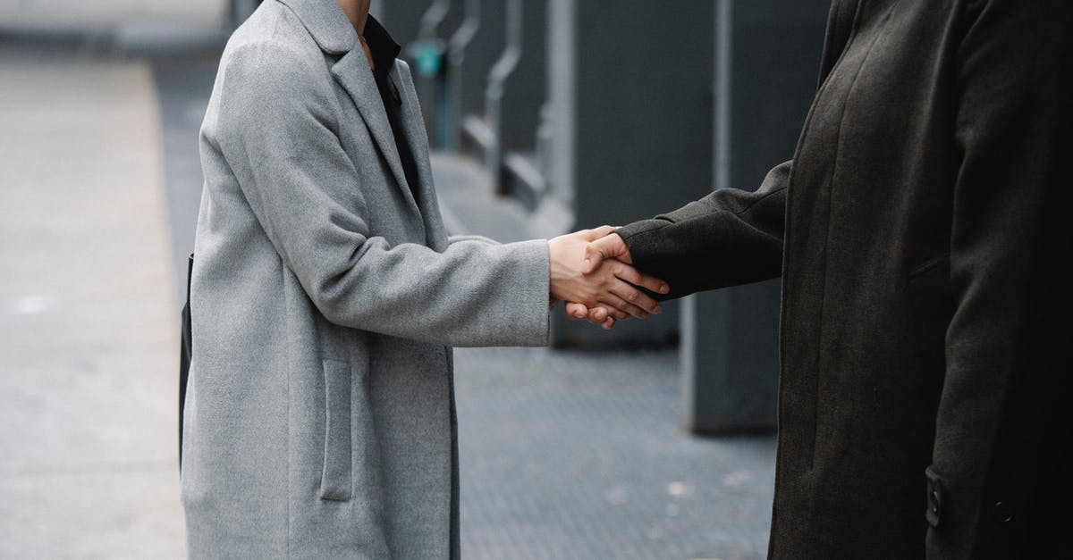 What is this downtown side job during the Corpo prologue? - Crop anonymous man and woman in elegant coats shaking hands on street while having meeting in city downtown