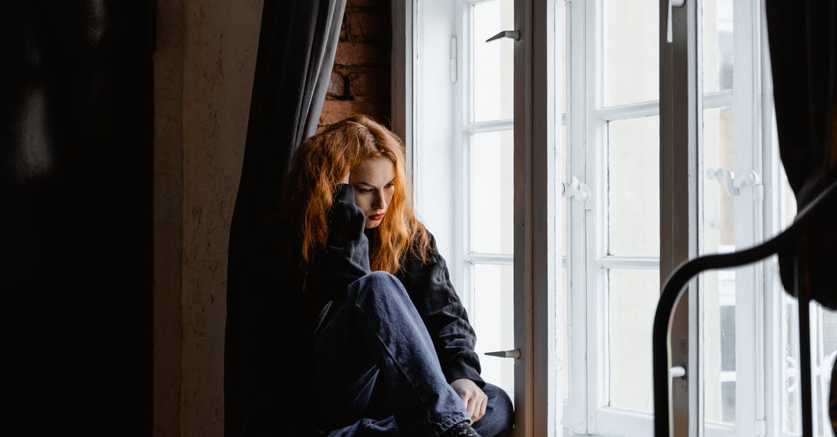 What is this end portal thingy? - Woman in Black Leather Jacket Sitting on Brown Wooden Floor