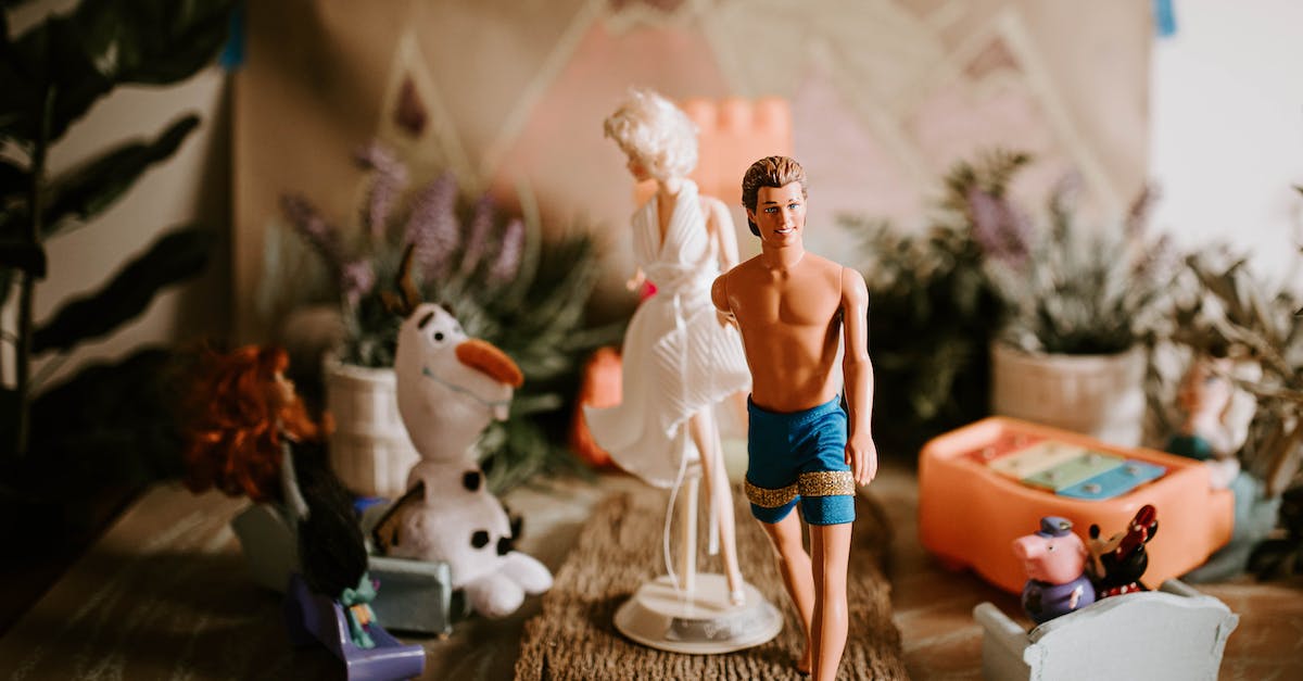 What is this game with skeletal characters? - Newlywed couple of dolls holding hands at romantic wedding ceremony with guests sitting in audience