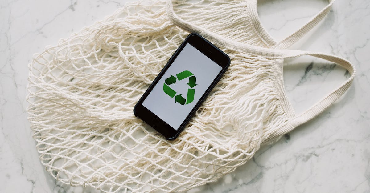 What is this icon at the top of the screen? - White mesh bag with smartphone placed on white surface in light room What is this icon at the top of the screen? - White mesh bag with smartphone placed on white surface in light room