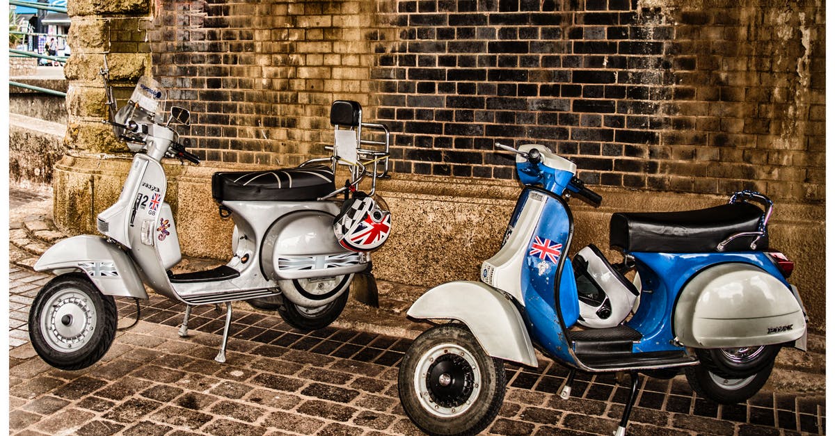 What is this machine in Wall Market? - White and Blue Scooter Motorcycles What is this machine in Wall Market? - White and Blue Scooter Motorcycles