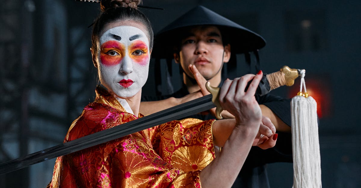 What is this Mortal Kombat II manual? - Shallow Focus of a Man and Woman in Their Game Character Costumes What is this Mortal Kombat II manual? - Shallow Focus of a Man and Woman in Their Game Character Costumes