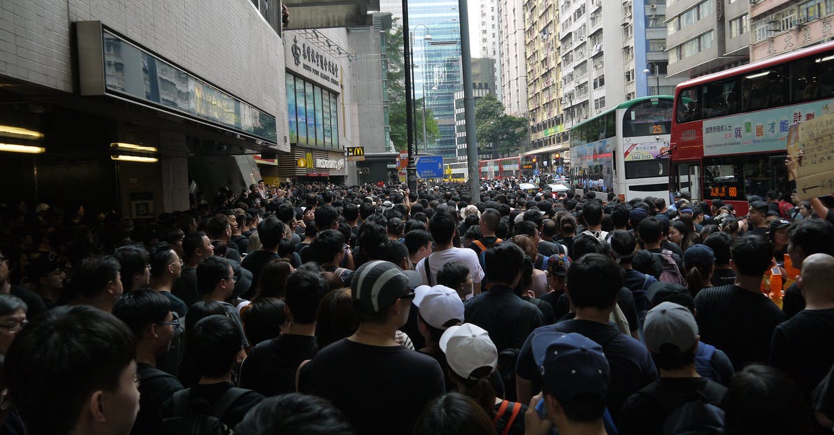 What is this Pokémon Go event I've heard about? - Ethnic group of people moving in street What is this Pokémon Go event I've heard about? - Ethnic group of people moving in street