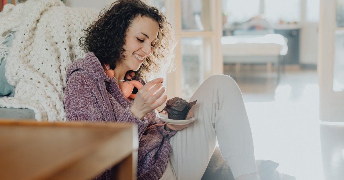 What is this room with a smiling spider in it? - Woman Eating a Cake at Home