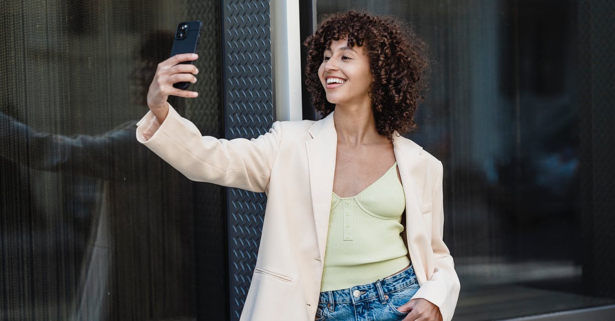 What kind of tarot is used in Persona 5? - Positive ethnic woman taking self portrait on smartphone in town What kind of tarot is used in Persona 5? - Positive ethnic woman taking self portrait on smartphone in town