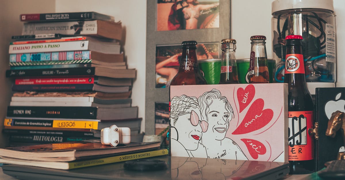 What literature did Nate and Nora keep on their shelves? - Shelf with stacked books laptop and drink bottles What literature did Nate and Nora keep on their shelves? - Shelf with stacked books laptop and drink bottles
