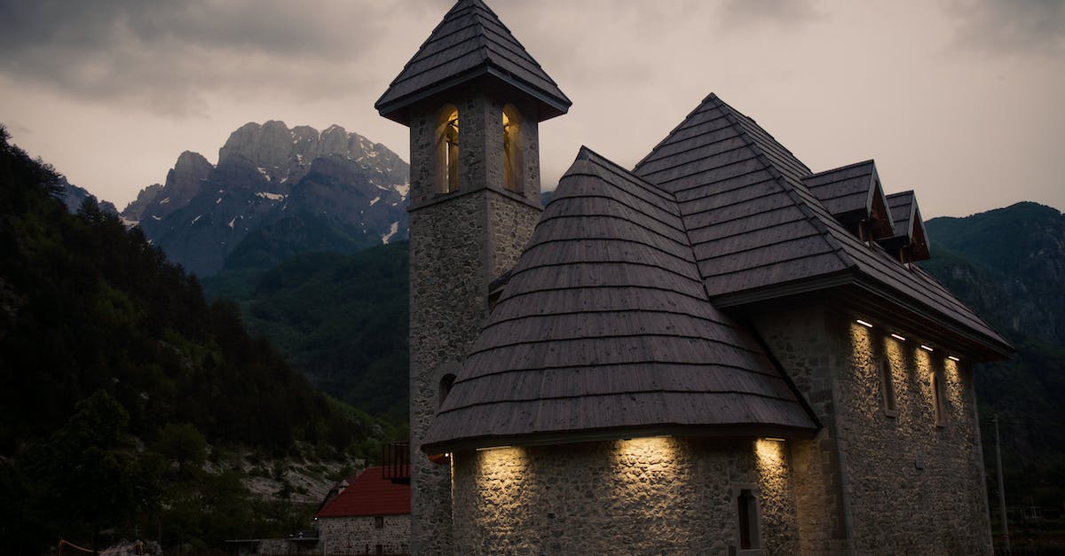 What makes the Sacred Combo so sacred? - Brown and Gray Concrete Building Near Green Grass Field and Mountain