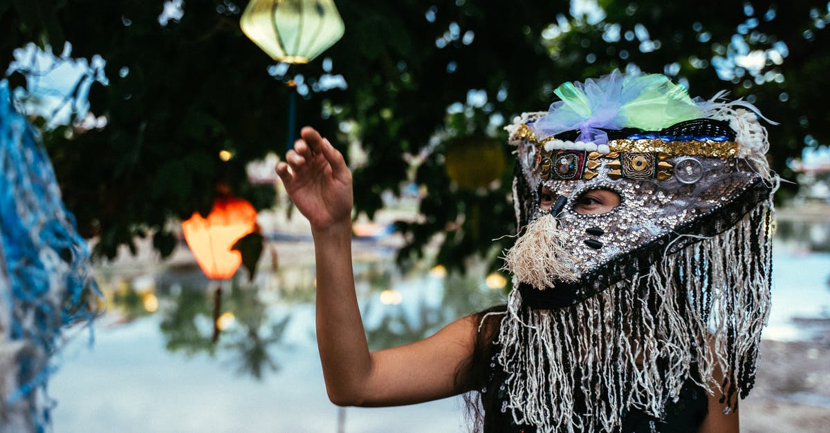 What mask is this? - Person With Yellow and Blue Feather Headdress What mask is this? - Person With Yellow and Blue Feather Headdress
